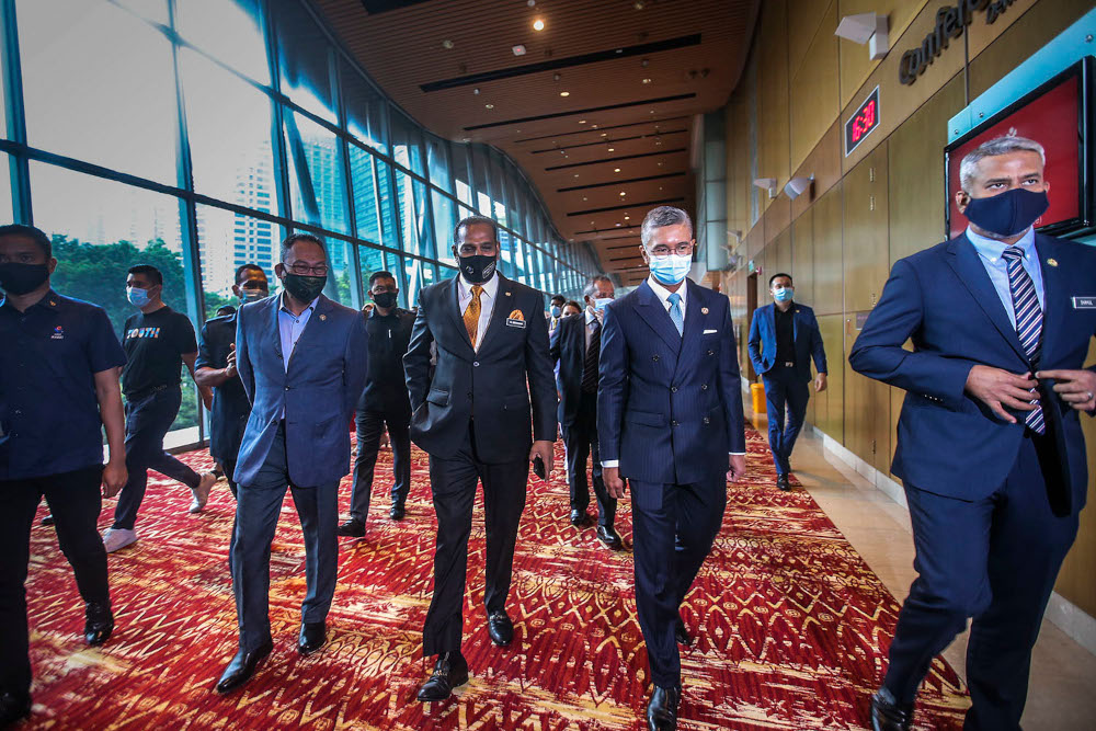 HR Minister Datuk Seri M. Saravanan and Finance Minister Datuk Seri Tengku Zafrul Tengku Abdul Aziz arrive for the launch of HRDF Placement Centre at Kuala Lumpur Convention Centre, April 6, 2021. u00e2u20acu2022 Picture by Hari Anggara