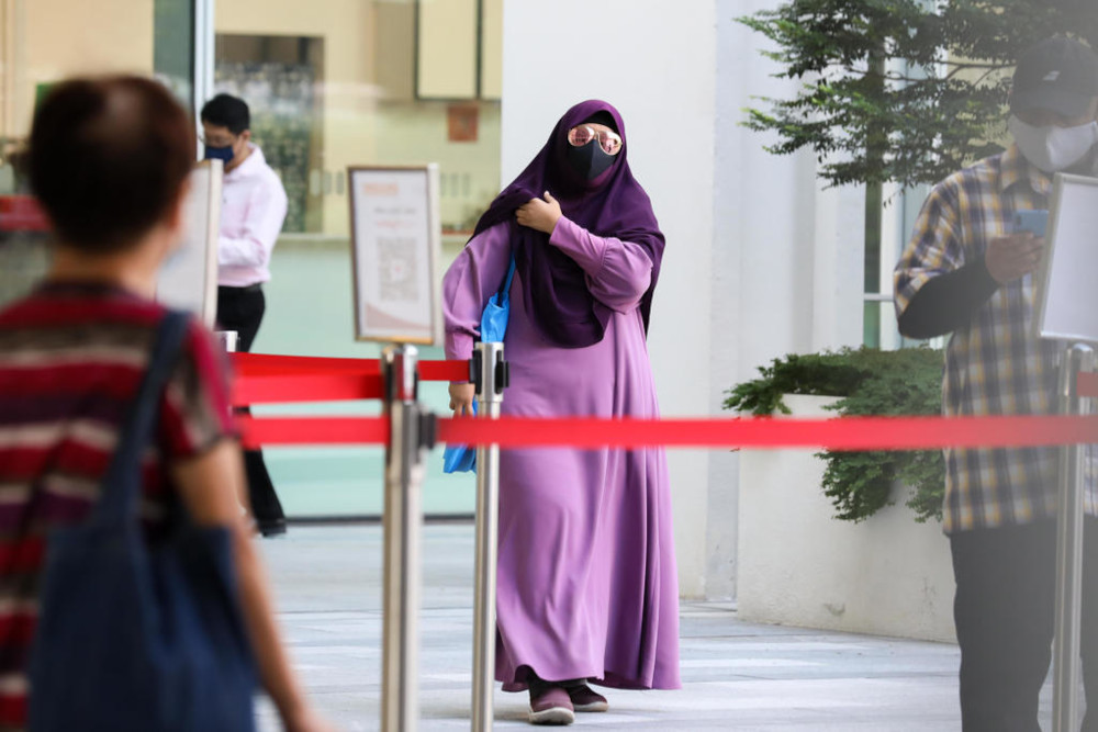 Ummi Kalsum Ali arriving at the State Courts April 28, 2021. u00e2u20acu201d TODAY picnn