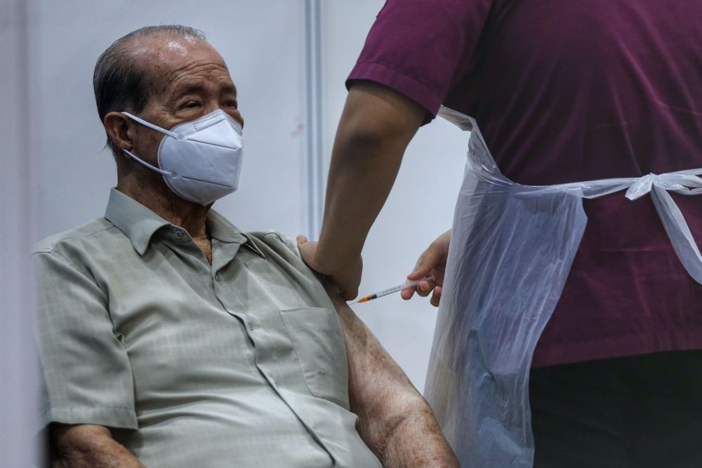 A senior citizen receives his Covid-19 jab at a vaccination centre at the Sunway Pyramid Convention Centre, Petaling Jaya April 27, 2021. u00e2u20acu201d Picture by Ahmad Zamzahuri