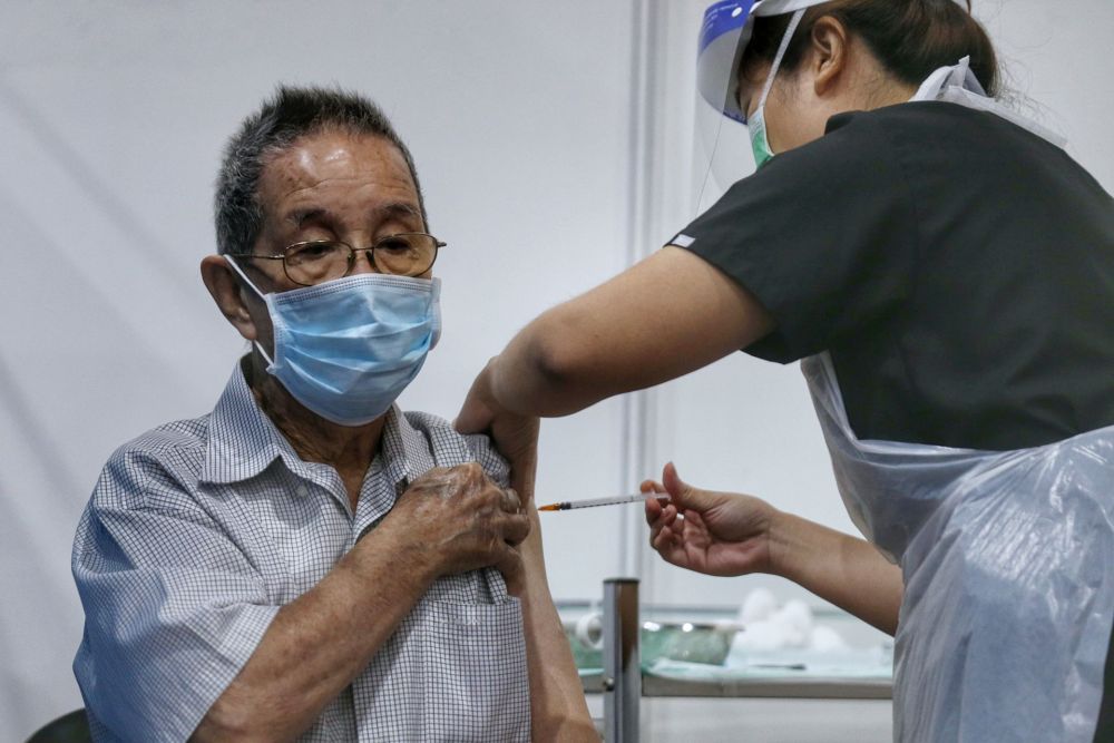 A senior citizen receives his Covid-19 jab at a vaccination centre at the Sunway Pyramid Convention Centre, Petaling Jaya April 27, 2021. u00e2u20acu201d Picture by Ahmad Zamzahuri