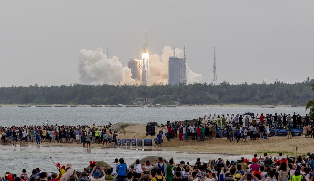 People watch a Long March 5B rocket, which carries Chinau00e2u20acu2122s Tianhe space station core module, lifting off from the Wenchang Space Launch Center, in southern Chinau00e2u20acu2122s Hainan province on April 29, 2021. u00e2u20acu201d AFP pic