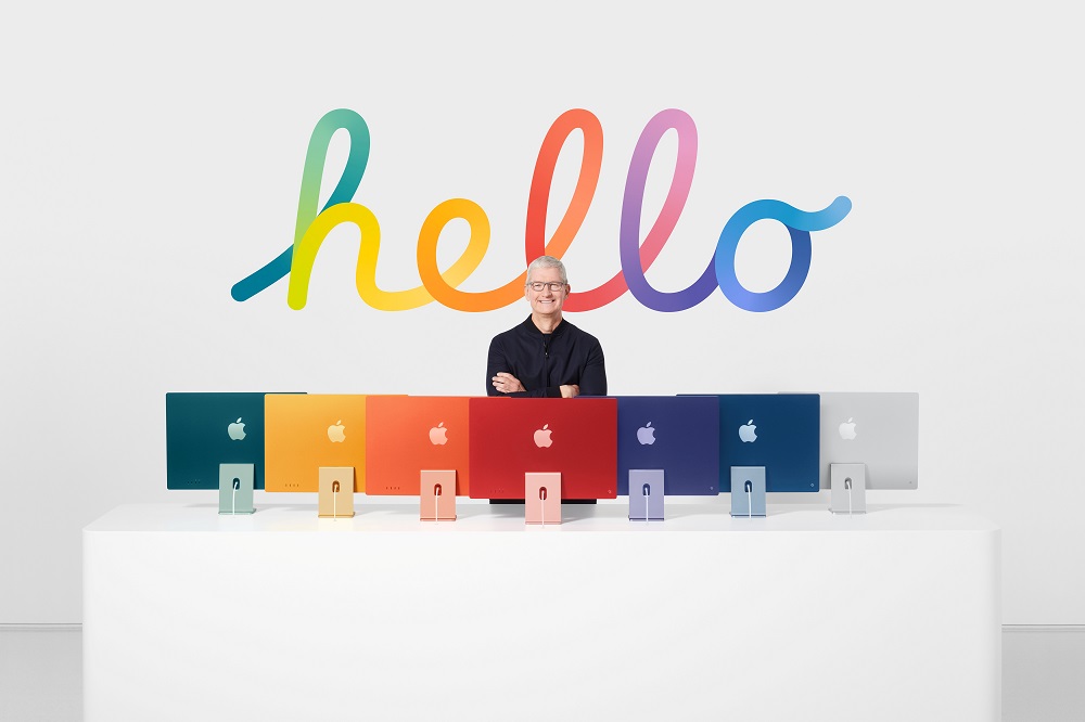 Apple CEO Tim Cook stands with the all-new iMac lineup, in this still image from the keynote video of a special event at Apple Park in Cupertino, California released April 20, 2021. u00e2u20acu2022 Apple Inc/Handout via Reuters