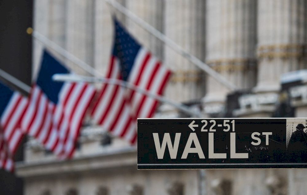 In this file photo a Wall St sign hangs at the New York Stock Exchange (NYSE) at Wall Street on March 23, 2021 in New York City. u00e2u20acu201d AFP pic