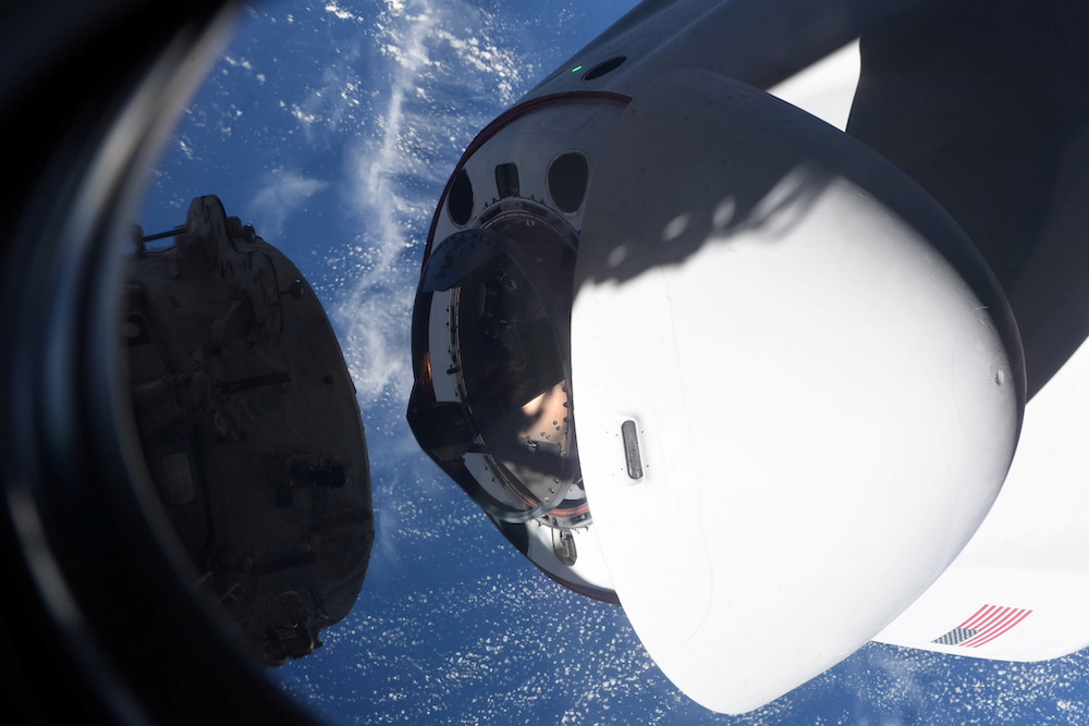 The SpaceX Crew Dragon capsule Endeavor, carrying four astronauts, approaches the International Space Station orbiting the Earth April 24, 2021. u00e2u20acu201d Mike Hopkins/Nasa handout via Reuters