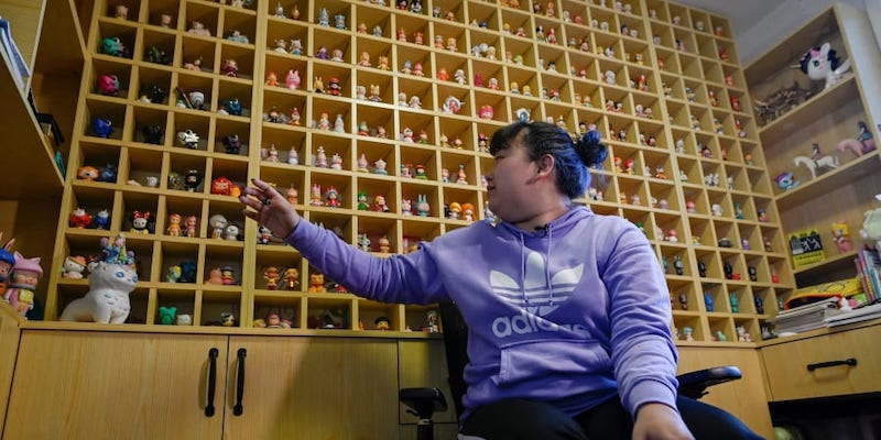 Music student Wang Zhaoxue showing the u00e2u20acu02dcblind boxu00e2u20acu2122 toys she collected, during an interview at her home in Beijing. u00e2u20acu201d AFP pic