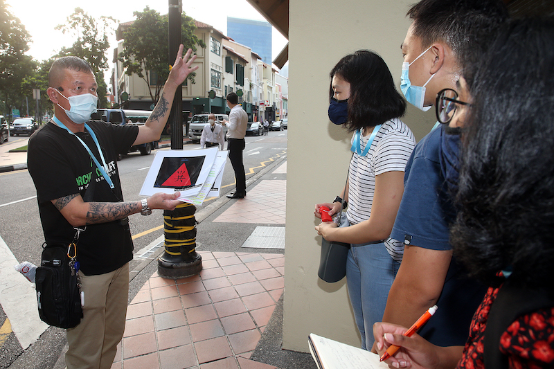 Tour guide Alvin Chiong leading participants on the Triad Trail tour on April 28, 2021. — TODAY pic