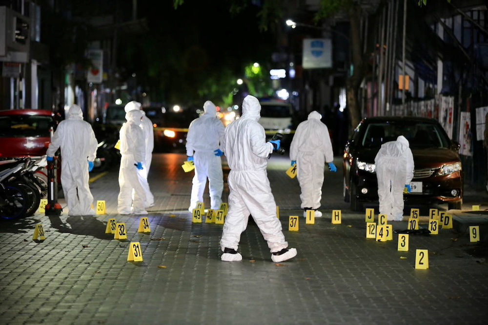 Maldivian police officers inspect the area after a blast outside the family home of the speaker of parliament, former President Mohamed Nasheed, in Male, Maldives May 6, 2021. u00e2u20acu201d Maldives Police Service handout via Reuters