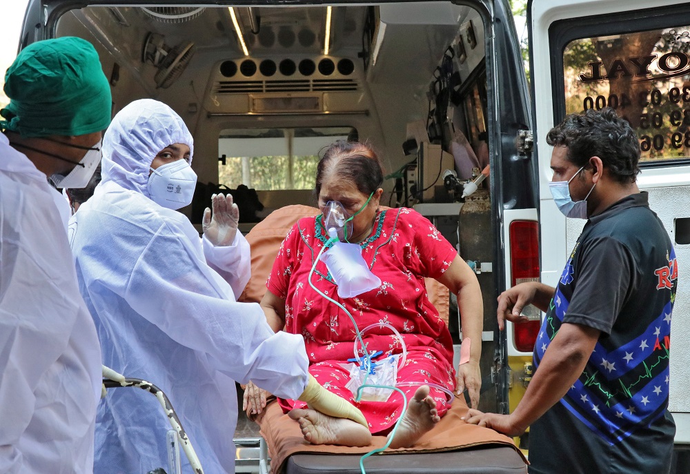 Healthcare workers and relatives carry a woman from an ambulance for treatment at a Covid-19 care facility, amidst the spread of the coronavirus disease in Mumbai May 4, 2021. u00e2u20acu201d Reuters pic