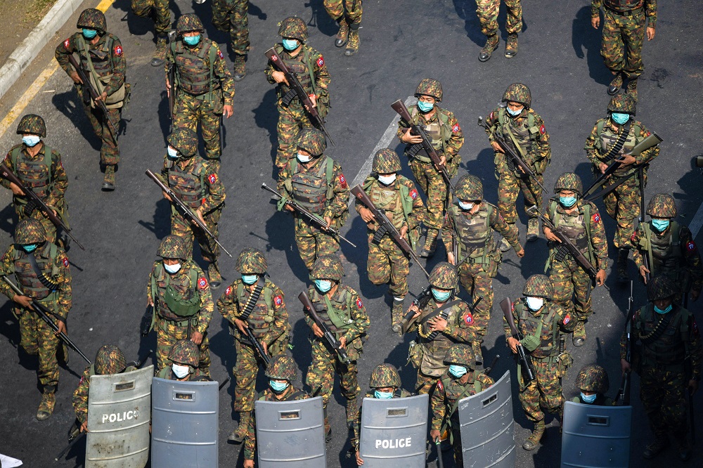 Myanmar soldiers walk along a street during a protest against the military coup in Yangon February 28, 2021. u00e2u20acu201d Reuters pic