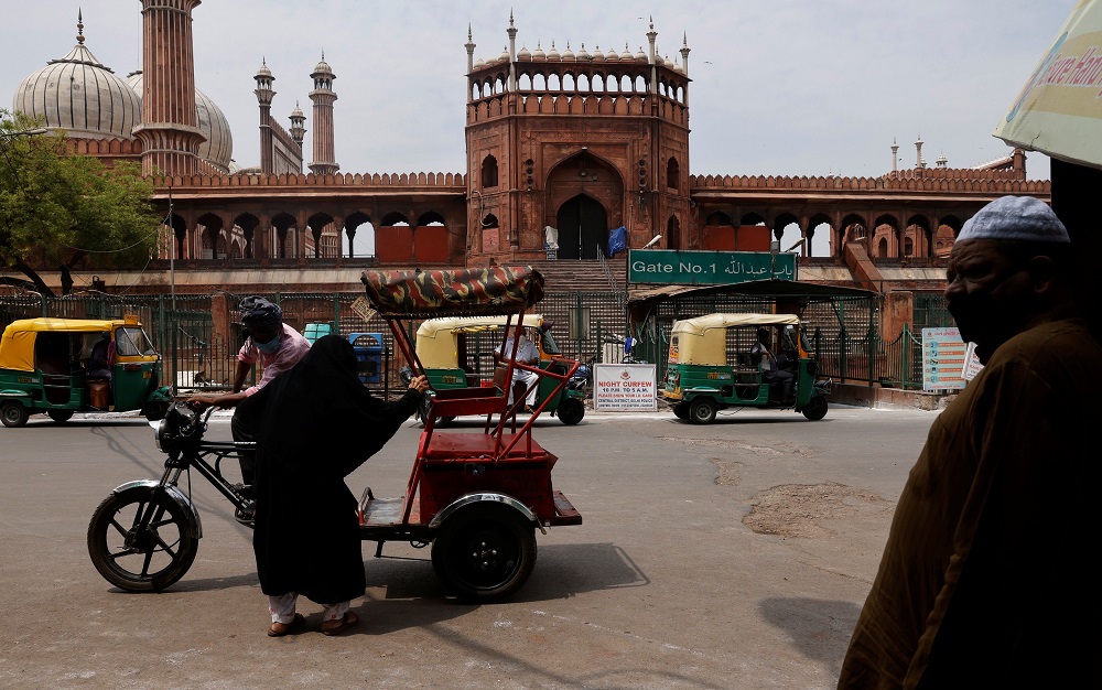A woman sits in a rickshaw in front of Jama Masjid or Grand Mosque during a lockdown to limit the spread of the coronavirus disease, in the old quarters of Delhi May 7, 2021. u00e2u20acu201d Reuters pic