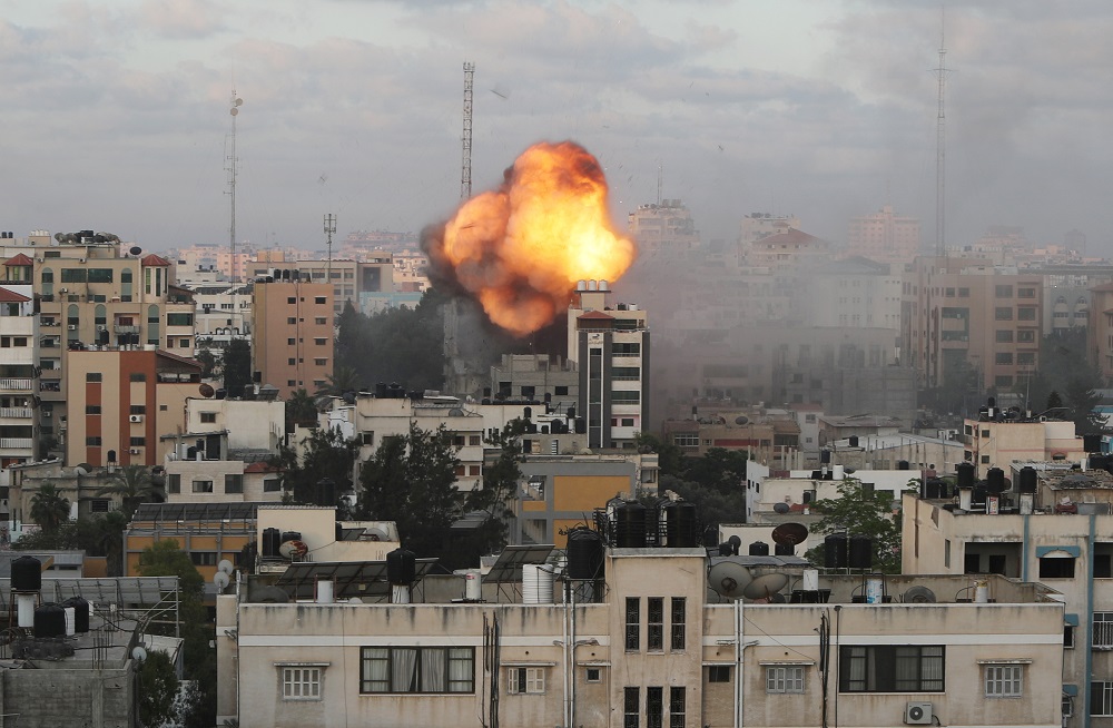 Smoke and flames are seen following an Israeli air strike on a building, amid a flare-up of Israeli-Palestinian fighting, in Gaza City May 18, 2021. u00e2u20acu201d Reuters pic