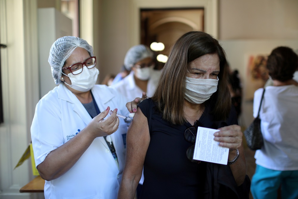 A woman receives the Oxford-AstraZeneca coronavirus disease vaccine, at the Catete Palace in Rio de Janeiro, Brazil April 23, 2021. u00e2u20acu201d Reuters pic