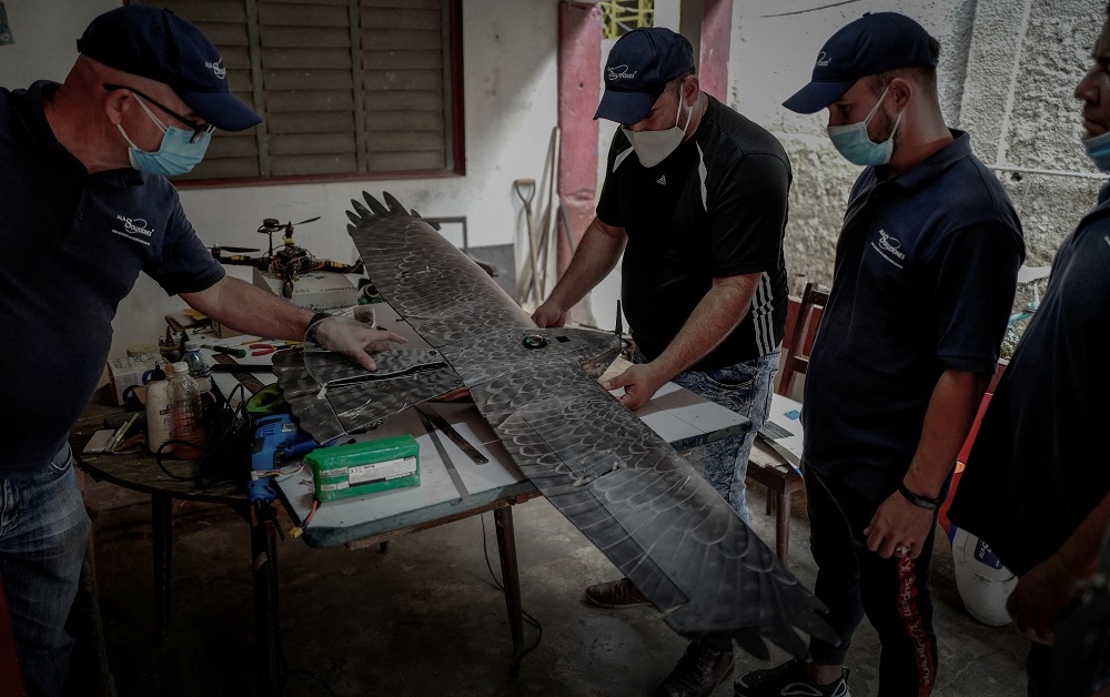 Erick Carmona (centre), CEO of Alasoluciones, and members Mykol Diaz (right) and Ernesto Aragon (left) work on drones at their workshop in San Nicolas de Bari, Mayabeque province, Cuba. u00e2u20acu201d AFP pic