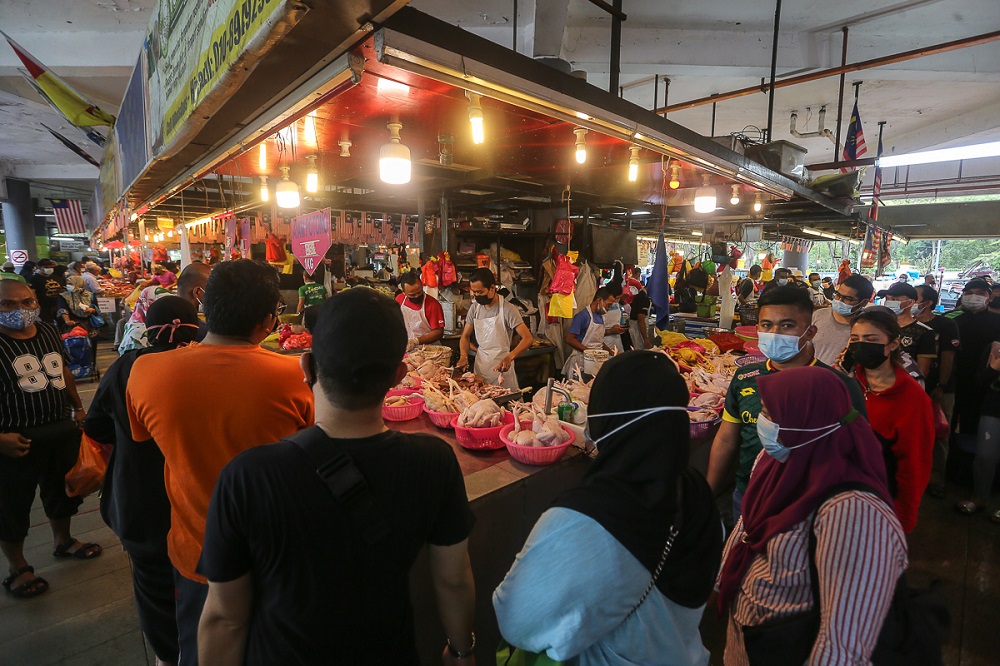Customers shop at the Seksyen 6 wet market in Shah Alam May 11, 2021. u00e2u20acu201d Picture by Yusof Mat Isa