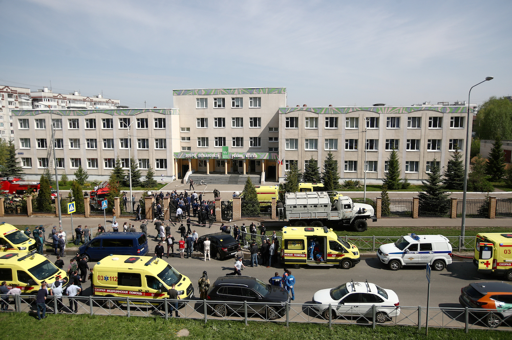 Police cars and ambulances by school No 175 where two attackers opened fire; at least one teacher and eight students are reported dead. u00e2u20acu201d TASS pic via Reuters