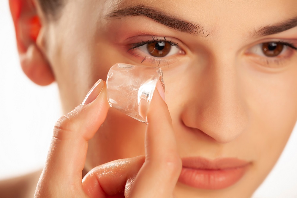 A simple ice cube may help you get rid of your dark circles. u00e2u20acu201d Shutterstock pic via ETX Studio