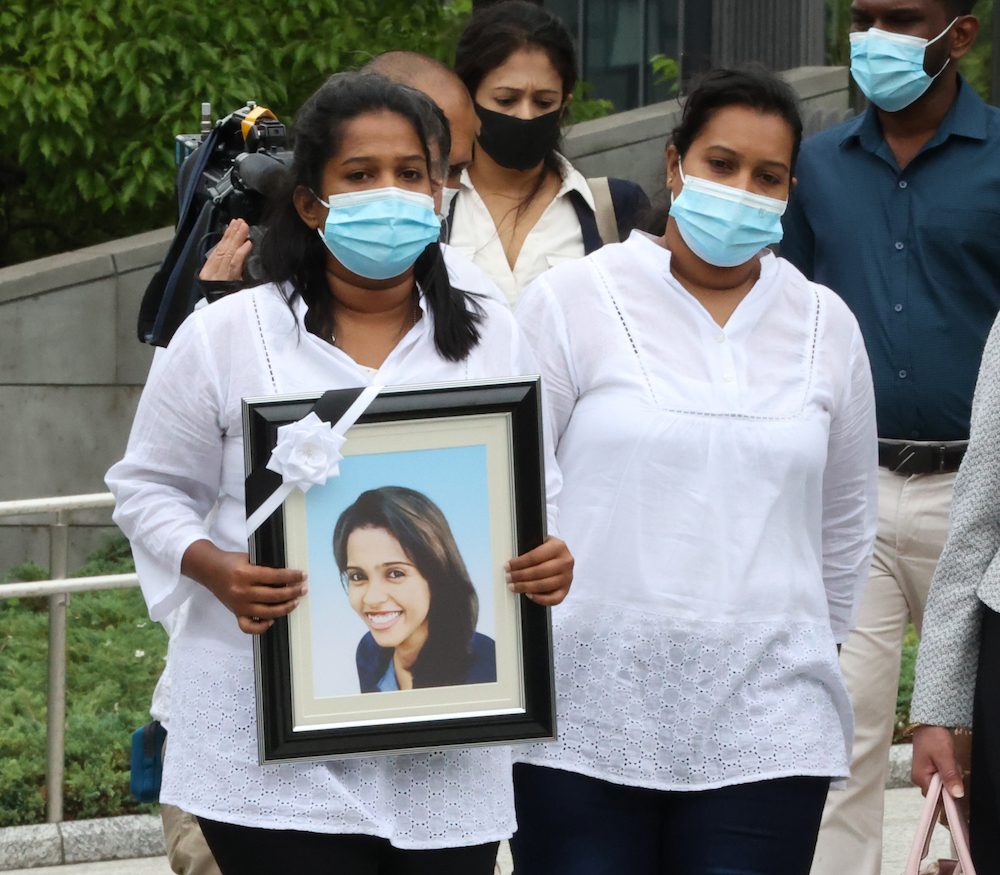 The family of Ratnayake Liyanage Wishma Sandamali who died in March holding her photo heads for Diet Building in Tokyo on May 18, 2021. u00e2u20acu201d Reuters pic 