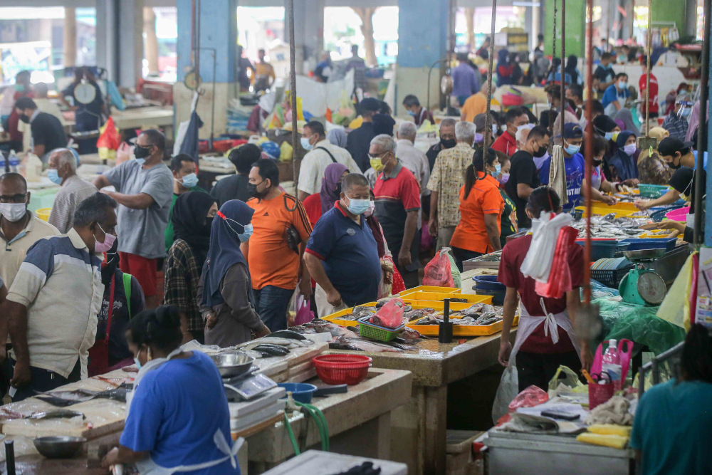 People thronged the Pasar Besar Ipoh to stock up their supplies as government announced the enhanced movement control order (EMCO) in Ipoh May 21, 2021. u00e2u20acu201d Picture by Farhan Najib