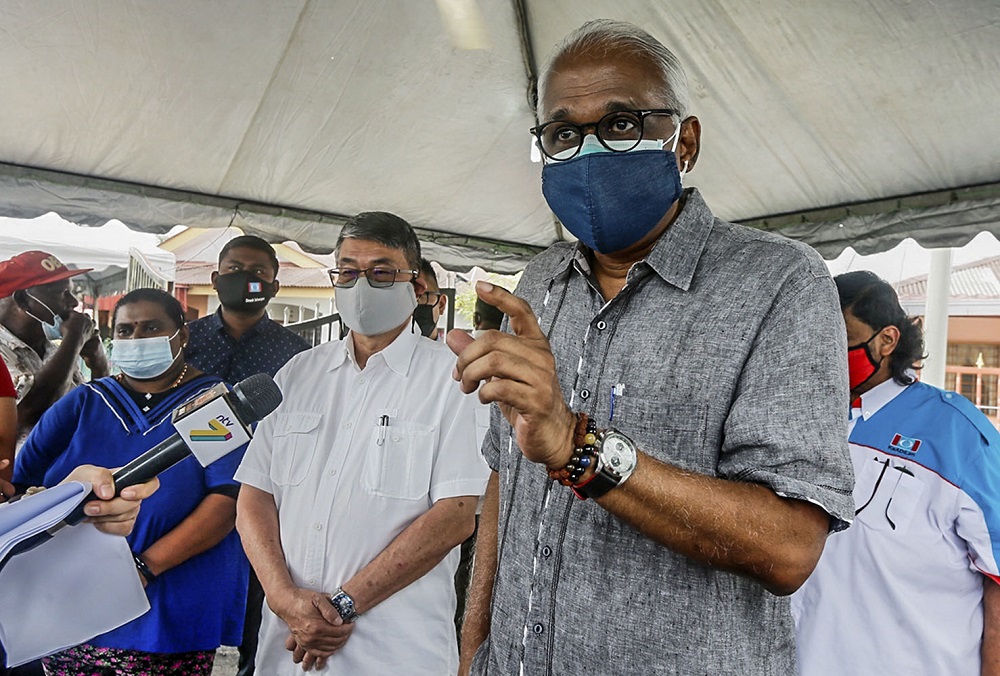 Klang MP Charles Santiago (right) and Selayang MP William Leong speak to reporters at the late Subramaniamu00e2u20acu2122s home in Taman Selayang Mutiara in Selayang May 22, 2021. u00e2u20acu201d Picture by Hari Anggara