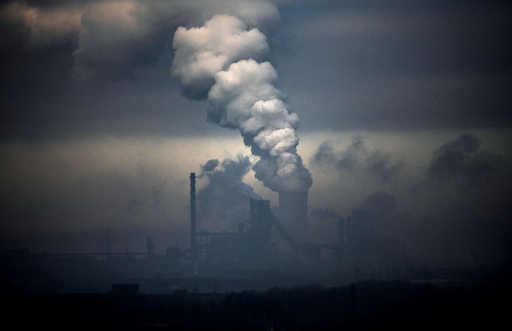 This file photo taken on January 23, 2020 shows a plant of German industrial conglomerate ThyssenKrupp (foreground) and a coal-fired power station in Duisburg, western Germany. u00e2u20acu201d AFP pic