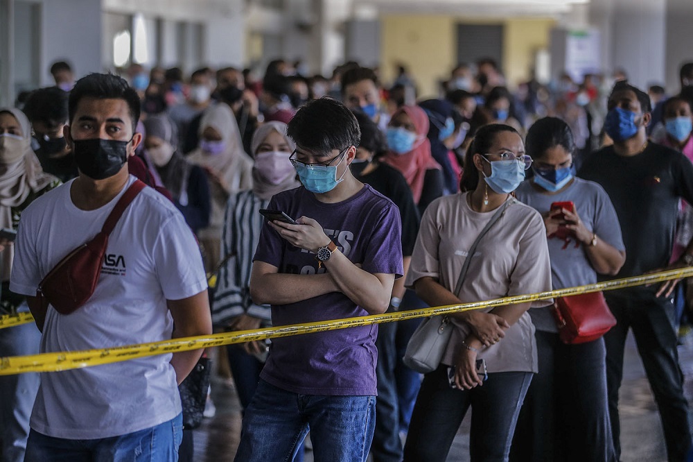 People wait in line to receive their AstraZeneca Covid-19 vaccine shot at the Vaccine Delivery Centre located at Kuala Lumpur World Trade Centre May 29, 2021. u00e2u20acu201d Picture by Hari Anggara