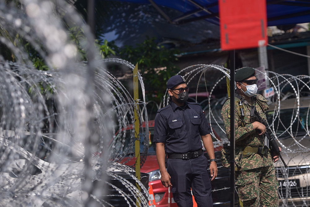 Barbed wire is seen around PPR Kampung Limau in Pantai Dalam after EMCO was imposed on the area, May 23, 2021. u00e2u20acu201d Picture by Miera Zulyana