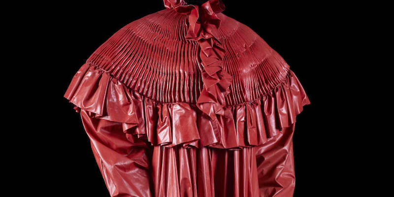 Paco Rabanne: Spring-summer 1985 (look Nu00c2u00b019) Coachmanu00e2u20acu2122s COAT, Red coated fabric, u00e2u201au00ac300 - u00e2u201au00ac500. u00e2u20acu201d Picture by Louis Du00c3u00a9camps via ETX Studio