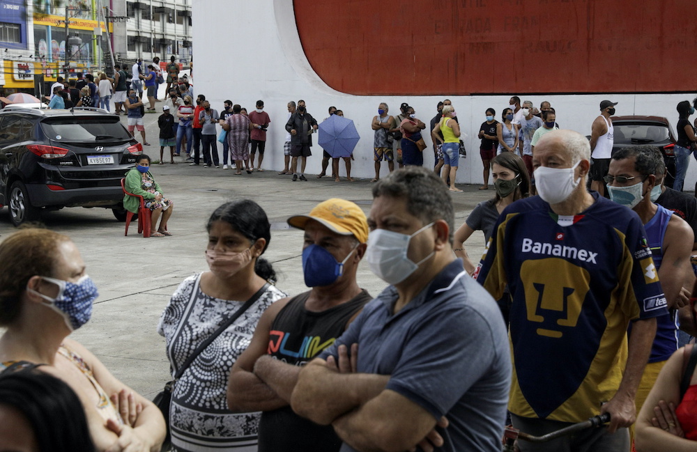 Citizens wait to receive a dose of the AstraZeneca coronavirus disease vaccine, during a vaccination day for 57-year-old and older citizens, in Duque de Caxias near Rio de Janeiro, Brazil April 21, 2021. — Reuters pic