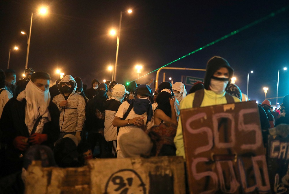 A laser pointer is used as demonstrators attend a protest demanding government action to tackle poverty, police violence and inequalities in healthcare and education systems, in Bogota, Colombia May 10, 2021. u00e2u20acu2022 Reuters pic