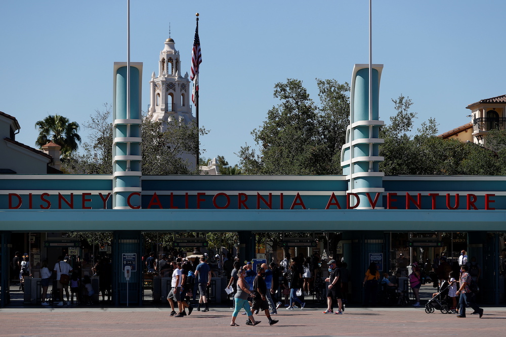 People walk outside Disneyland Park on its reopening day amidst the coronavirus disease outbreak, in Anaheim, California, US, April 30, 2021. u00e2u20acu201d Reuters pic