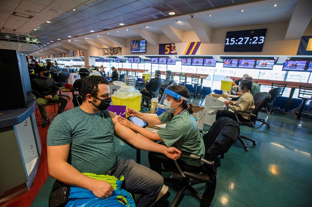 A healthcare worker administers the Pfizer/BioNTech vaccine at Woodbine Racetrack pop-up vaccine clinic in Toronto, Ontario, Canada May 5, 2021. u00e2u20acu2022 Reuters file pic