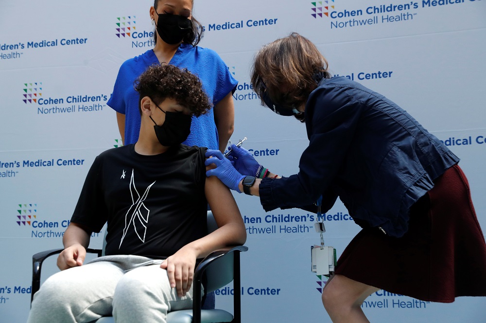 A teenager receives a dose of the Pfizer-BioNTech vaccine at Northwell Health's Cohen Children's Medical Center in New Hyde Park, New York May 13, 2021. u00e2u20acu2022 Reuters pic