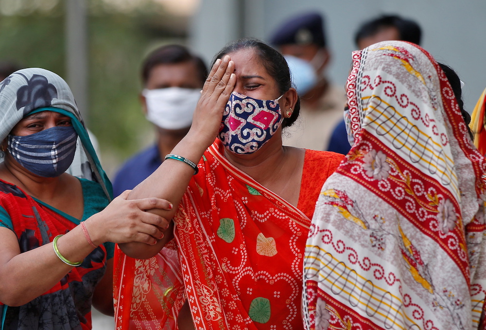 A woman mourns after her husband died due to the coronavirus disease outside a mortuary of a Covid-19 hospital in Ahmedabad, India, May 8, 2021. u00e2u20acu2022 Reuters pic