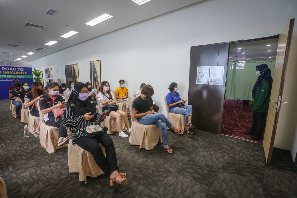 People wait to receive the second dose of Pfizer-BioNTech Covid-19 vaccine at the KPJ Selangor Specialist Hospital in Shah Alam May 25, 2021. u00e2u20acu201d Picture by Yusof Mat Isa