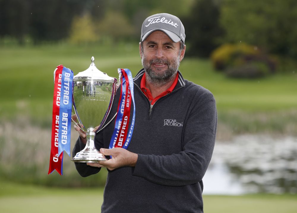 England's Richard Bland celebrates winning the British Masters with the trophy at The Belfry, Sutton Coldfield May 15, 2021. u00e2u20acu201d Reuters pic