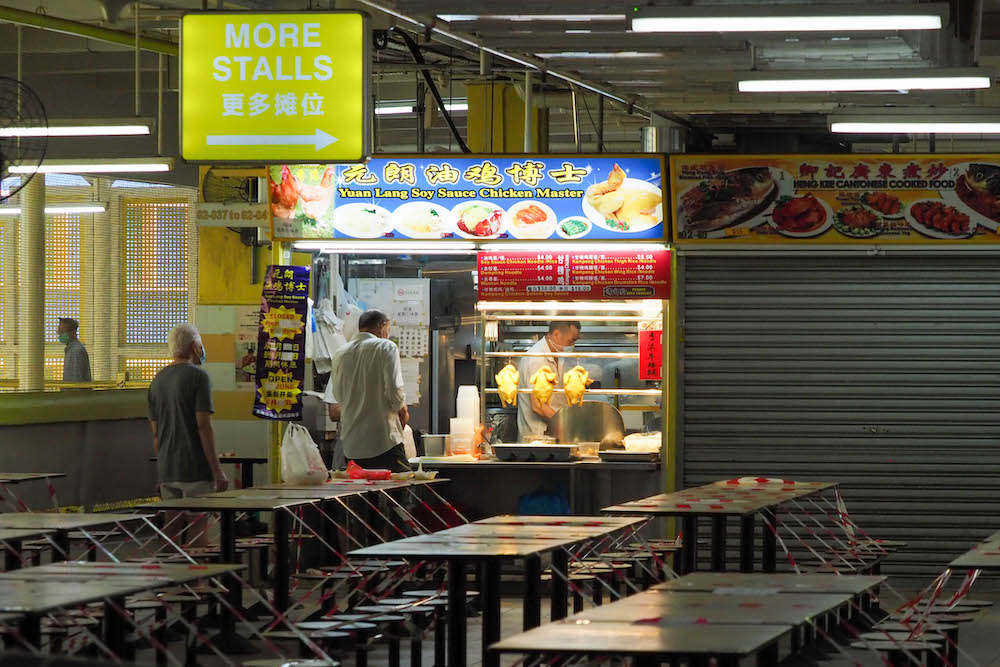 After surviving the circuit breaker last year, many hawkers — especially the older ones who are not digitally savvy — are struggling to keep their stalls open under the Phase 2 (heightened alert) community restrictions. — Photo by Raj Nadarajan for