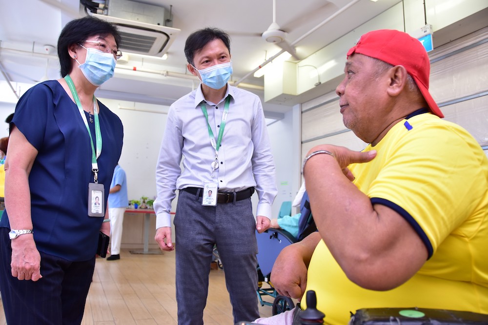 en Ci chief nurse Jenny Sim Teck Meh (left), 70, checking in on a nursing home resident who received his vaccination on Jan 20, 2021. ― Photo courtesy of Ren Ci