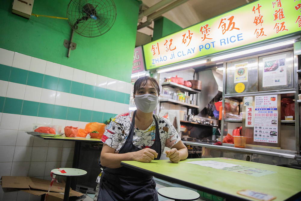 Ms Deng Shu Ling, owner of the popular Zhao Ji Claypot Rice at Chinatown Complex Food Centre, said that her stall is seeing only 5 per cent of its usual crowd. — Photo by Ili Nadhirah Mansor for TODAY