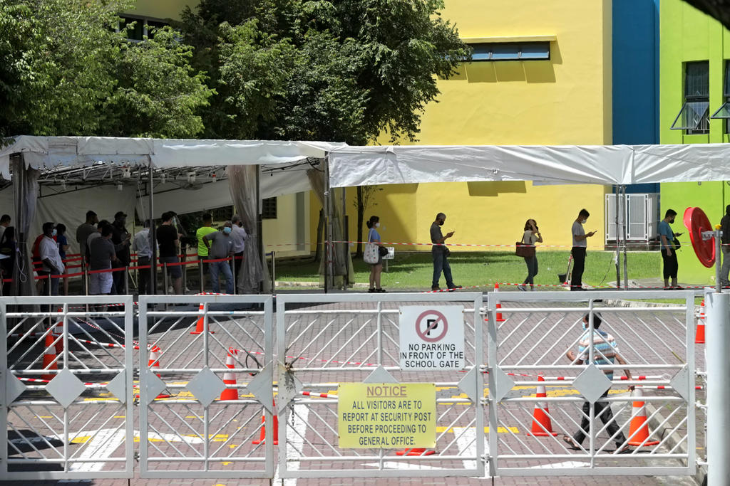 People queuing at the former Da Qiao Primary School in Ang Mo Kio, one of the Covid-19 swab test centres on May 3, 2021. u00e2u20acu2022 TODAY pic