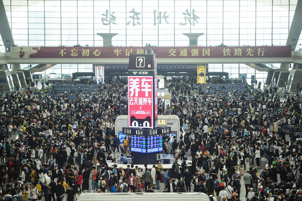Passengers prepare to board trains at Hangzhou East train station in Hangzhou, in China's eastern Zhejiang province on April 30, 2021, ahead of the Labour Day holiday which starts on May 1. u00e2u20acu201d AFP pic