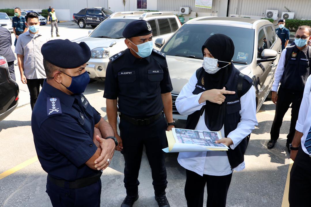 Datuk Ayob Khan Mydin Pitchay (far left) during an operation to check on workplace compliance under the third phase of the movement control order in Pasir Gudang May 25, 2021. u00e2u20acu201d Picture courtesy of Johor police