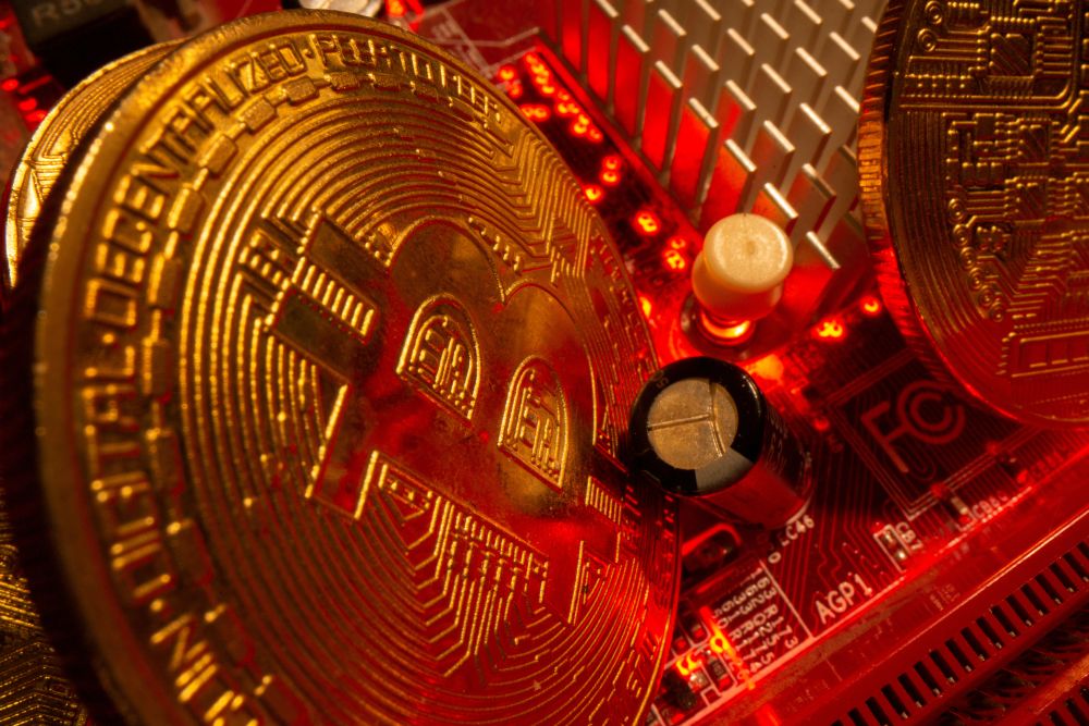Representations of the virtual currency Bitcoin stand on a motherboard in this picture illustration taken May 20, 2021. u00e2u20acu201d Reuters pic