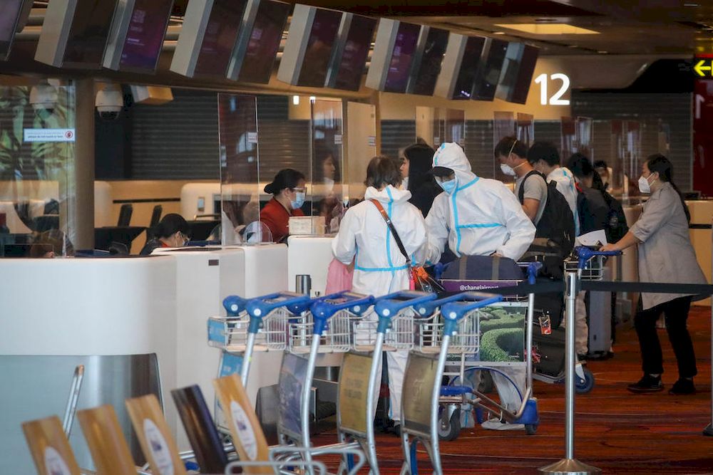 Departing passengers at Changi Airport Terminal 1 wearing personal protective equipment on May 14, 2021. u00e2u20acu201d TODAY pic