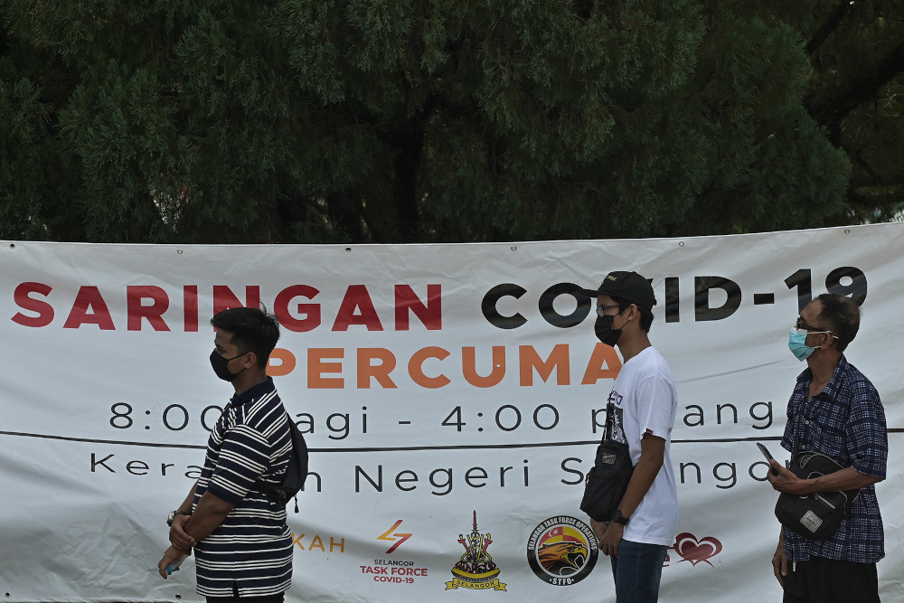 People attend a Covid-19 public community screening by Selcare in Hulu Kelang, May 18, 2021. u00e2u20acu201d Picture by Miera Zulyana