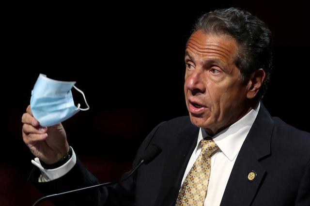 New York Governor Andrew Cuomo holds a protective mask as he speaks while making an announcement at a news conference from the stage at Radio City Music Hall in Manhattan in New York City, New York, US, May 17, 2021. u00e2u20acu201d Reuters pic