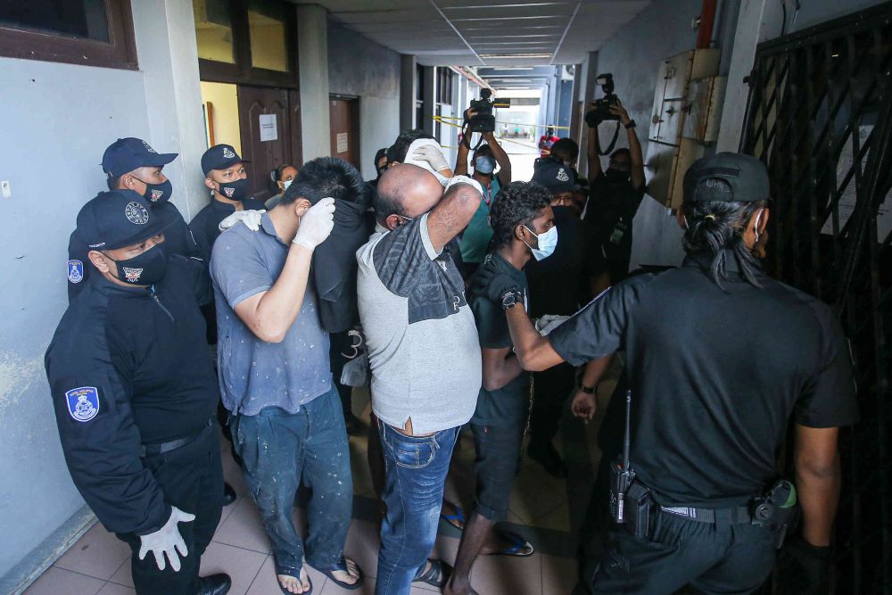Seven men were charged with being part of an organised crime gang called u00e2u20acu02dcGeng Nantha Kumaru00e2u20acu2122 at the Ipoh Sessions Court May 6, 2021. u00e2u20acu201d Picture by Farhan Najib