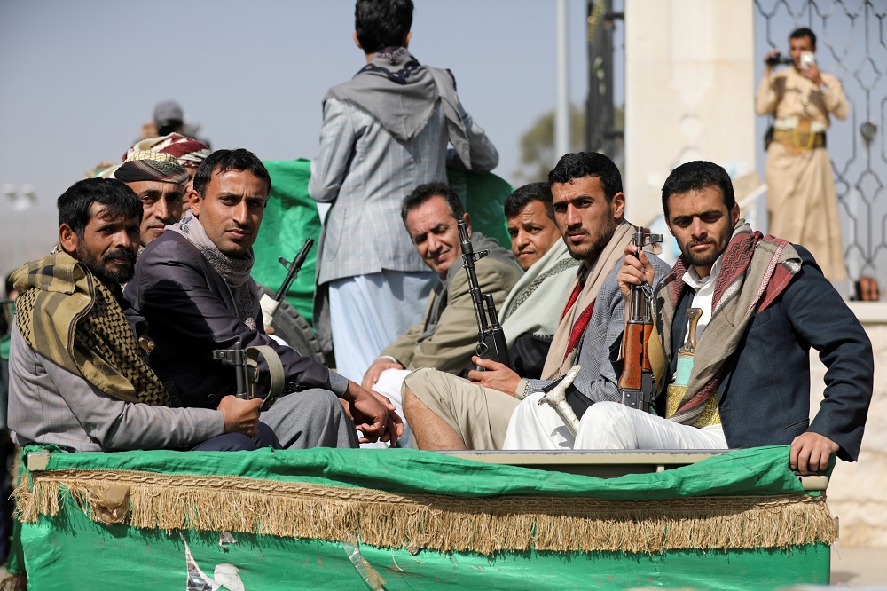 Armed Houthi followers ride on the back of a truck after participating in a funeral of Houthi fighters killed in recent fighting against government forces in Yemen's oil-rich province of Marib, in Sanaa, Yemen February 20, 2021. u00e2u20acu2022 Reuters file pic