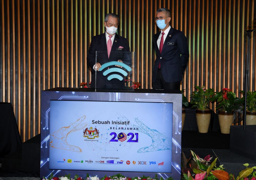 Prime Minister Tan Sri Muhyiddin Yassin (left) officiates the launch of 'Jaringan Prihatin' at the Ministry of Finance in Putrajaya May 5, 2021. u00e2u20acu201d Bernama pic