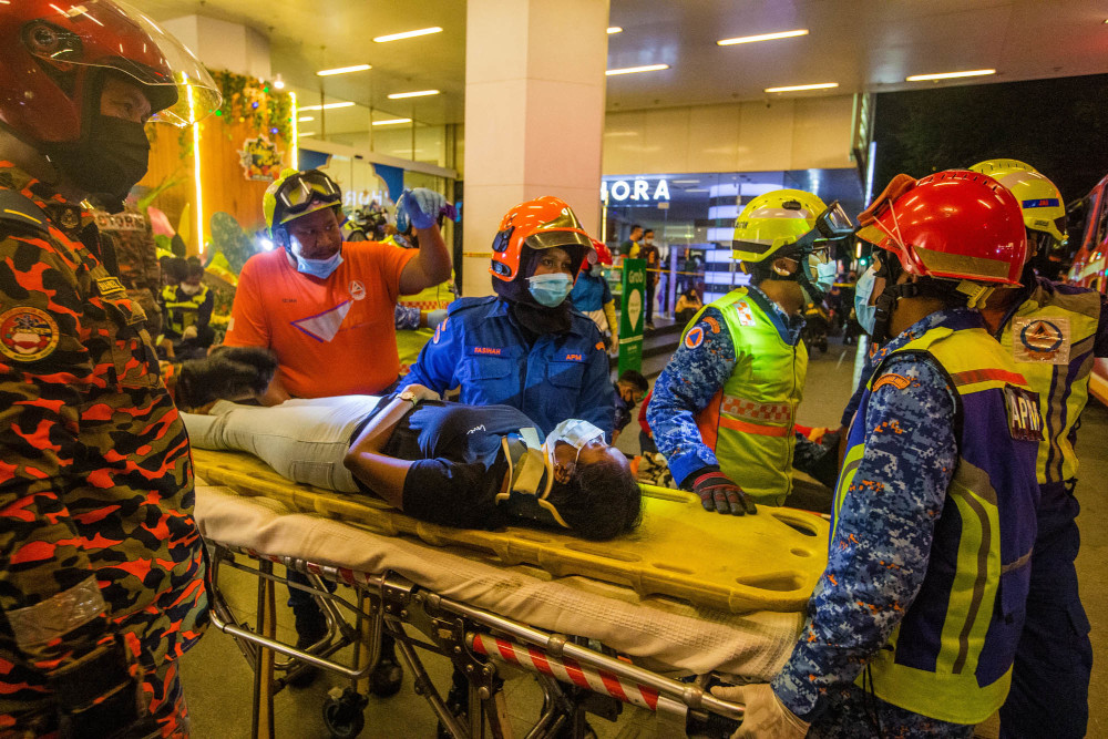 Rescue personnel tending to injured passengers at KLCC station during an incident involving trains numbered 40 and 81 at the LRT Kelana Jaya line, May 24, 2021. u00e2u20acu201d Picture by Firdaus Latifn