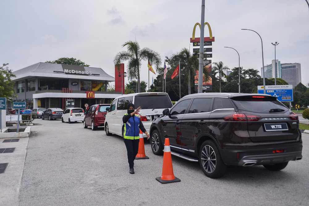 A long line of cars at the drive-thru section of McDonald’s in Seksyen 3, Shah Alam May 26, 2021. — Picture by Miera Zulyana